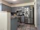 Kitchen with stainless steel refrigerator and a view of the tiled flooring at 8396 Yamhill St, Las Vegas, NV 89123