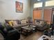 Inviting living room featuring plush sofas, hardwood floors, natural light, and stylish decor at 8396 Yamhill St, Las Vegas, NV 89123