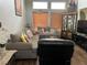 Inviting living room featuring plush sofas, hardwood floors, natural light, and stylish decor at 8396 Yamhill St, Las Vegas, NV 89123