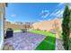 Private backyard with a barbecue, outdoor seating and artificial grass perfect for outdoor entertaining at 8502 Torozo Ave, Las Vegas, NV 89149