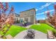 The backyard features artificial grass, a paver patio, and privacy fencing at 8502 Torozo Ave, Las Vegas, NV 89149