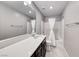 Clean bathroom with a single vanity, white countertops, and a shower over the tub at 8502 Torozo Ave, Las Vegas, NV 89149