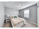 Cozy bedroom with neutral decor, a comfortable bed, and soft carpeting for a relaxing atmosphere at 8502 Torozo Ave, Las Vegas, NV 89149