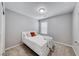 Relaxing bedroom with a comfortable bed, carpet flooring, and a window providing natural light at 8502 Torozo Ave, Las Vegas, NV 89149