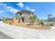 Two-story home featuring desert landscaping, and concrete sidewalk in front of the house at 8502 Torozo Ave, Las Vegas, NV 89149