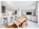 Open-concept living and dining area with modern finishes, creating an inviting atmosphere for entertaining at 8502 Torozo Ave, Las Vegas, NV 89149