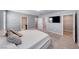 Spacious main bedroom showcasing a king bed, large windows, and access to the bathroom and closet at 8502 Torozo Ave, Las Vegas, NV 89149