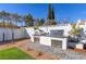 Outdoor kitchen with pizza oven, stainless steel grill, and countertop space at 8901 Dio Guardi Dr, Las Vegas, NV 89117