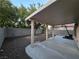 Backyard with covered patio, gravel landscaping, and block wall for privacy at 9662 Allison Ranch Ave, Las Vegas, NV 89148