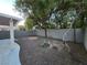 Backyard with gravel landscaping, patio, block wall and mature trees at 9662 Allison Ranch Ave, Las Vegas, NV 89148
