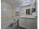 Clean white bathroom features a tub and shower combo, modern vanity, and neutral-toned walls and flooring at 9662 Allison Ranch Ave, Las Vegas, NV 89148