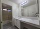 Bathroom featuring an extended vanity, sink, and large mirror at 9662 Allison Ranch Ave, Las Vegas, NV 89148