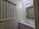 Bathroom featuring a white vanity and modern lighting fixture at 9662 Allison Ranch Ave, Las Vegas, NV 89148