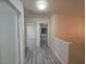 Hallway featuring gray wood flooring with doorways leading to rooms at 9662 Allison Ranch Ave, Las Vegas, NV 89148