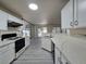 Modern kitchen featuring white cabinets, stainless appliances, and ample counter space at 9662 Allison Ranch Ave, Las Vegas, NV 89148