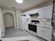 Updated kitchen featuring white cabinets, modern appliances, and stylish countertops at 9662 Allison Ranch Ave, Las Vegas, NV 89148