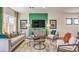 Cozy living room featuring stylish seating, an accent wall with a TV, and neutral décor at 9932 Ullom Dr # 5, Las Vegas, NV 89141