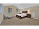 Bright bedroom features neutral walls, soft carpet, and a chair with ottoman at , Las Vegas, NV 89131