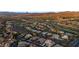 Desert neighborhood aerial shows lush community, nearby golf course at 10 Greely Club Trl, Henderson, NV 89052