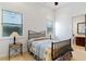 Cozy bedroom with two windows for natural light, with view to ensuite bathroom at 10 Greely Club Trl, Henderson, NV 89052
