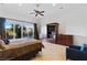 This main bedroom boasts backyard views, TV and tile flooring at 10 Greely Club Trl, Henderson, NV 89052