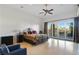 Bright bedroom with ceiling fan, large windows and access to backyard pool at 10 Greely Club Trl, Henderson, NV 89052