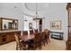Formal dining area showcasing classic furnishings, a tray ceiling, and neutral decor at 10 Greely Club Trl, Henderson, NV 89052