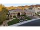 Elegant single-story home features desert landscaping, a tile roof, and an attached two-car garage at 10 Greely Club Trl, Henderson, NV 89052