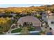 Beautiful aerial shot of an estate-style house with professional desert landscaping at 10 Greely Club Trl, Henderson, NV 89052