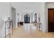 Bright foyer boasts decorative vases, detailed iron entry doors, and tiled flooring at 10 Greely Club Trl, Henderson, NV 89052