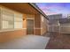 A cozy backyard space featuring a concrete patio and low-maintenance gravel landscaping for easy upkeep at 1009 Fishing St, Henderson, NV 89011