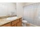 Bright bathroom features granite counters, single sink, and shower-tub combination at 1009 Fishing St, Henderson, NV 89011