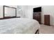 Bedroom with a bed, TV on a dresser, mirror, and carpet floors at 1009 Fishing St, Henderson, NV 89011