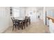 Bright dining area features a dark wood table with seating for six, and tile flooring at 1009 Fishing St, Henderson, NV 89011