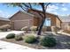 Well-maintained home featuring low-maintenance landscaping and a two-car garage at 1009 Fishing St, Henderson, NV 89011