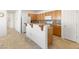 Spacious kitchen featuring an island and stainless steel appliances, creating a functional and stylish space at 1009 Fishing St, Henderson, NV 89011
