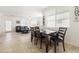 Open-concept living and dining area with abundant natural light and stylish furniture, great for gatherings at 1009 Fishing St, Henderson, NV 89011