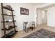 Bright office area with tile floors, a decorative shelving unit, and a simple desk at 1009 Fishing St, Henderson, NV 89011