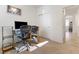 A home office space featuring a computer desk, shelves, and a sliding door closet at 1009 Fishing St, Henderson, NV 89011