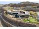 Expansive aerial view of a modern home with a pool, putting green, and landscaped grounds at 11 Cloud Chaser Blvd, Henderson, NV 89012