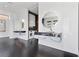 Modern bathroom with floating dual vanities, designer mirrors, and integrated laundry area at 11 Cloud Chaser Blvd, Henderson, NV 89012