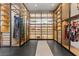 A large walk-in closet with custom shelving, mirrored doors, and a bench at 11 Cloud Chaser Blvd, Henderson, NV 89012