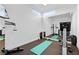 Home gym with full mirror wall, exercise equipment and yoga mat at 11 Cloud Chaser Blvd, Henderson, NV 89012