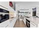 Modern kitchen with sleek cabinetry, marble countertops, and high-end appliances, open to the living space at 11 Cloud Chaser Blvd, Henderson, NV 89012