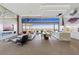 Expansive living space with floor-to-ceiling windows, offering city views and access to a modern kitchen at 11 Cloud Chaser Blvd, Henderson, NV 89012