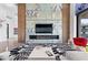 Elegant living area showcasing a statement fireplace and a cozy seating arrangement with stylish decor at 11 Cloud Chaser Blvd, Henderson, NV 89012