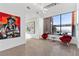 Bright living room with modern art, stylish seating, and expansive views at 11 Cloud Chaser Blvd, Henderson, NV 89012