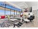 Bright, open living room with floor-to-ceiling windows and modern decor and gourmet kitchen at 11 Cloud Chaser Blvd, Henderson, NV 89012