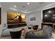 Home media room with large screen, comfortable seating, and built-in bar area at 11 Cloud Chaser Blvd, Henderson, NV 89012