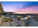 Outdoor kitchen and patio with spectacular sunset views of the city and mountains at 11 Cloud Chaser Blvd, Henderson, NV 89012